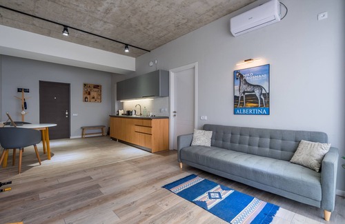 Vake Condo | Urban Loft Apt Ideal for Workcation, Couples & Families