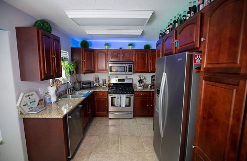 Tropic House | Urban Oasis W/hot Tub, Heated Pool And Private Movie Theater 2 Bedroom Home by RedAwning