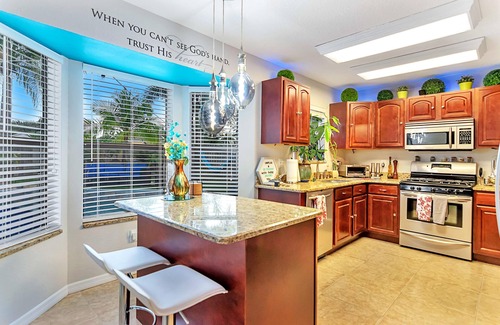 Tropic House | Urban Oasis w/Hot Tub, HEATED POOL and Private Movie Theater by RedAwning