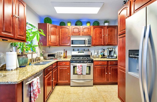 Tropic House | Urban Oasis w/Hot Tub, HEATED POOL and Private Movie Theater by RedAwning