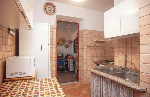 Porto Pino Villa | Vacation Home 'Fronte Mare Al Porticciolo' with Sea View, Barbecue Area & Wi-Fi