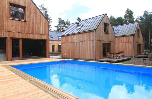 Osjakow Cottage | 'Verde' cottage in Small Family Friendly Resort in Forest upon Warta River
