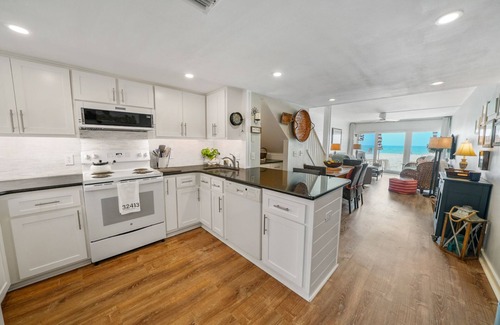 Sunnyside Condo | Very Merry! Gulf front corner unit, west end 2/2 New Remodel, Fantastic!