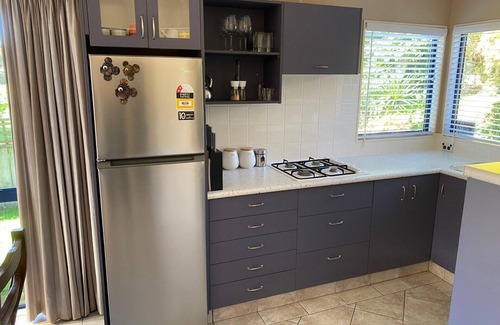 Papamoa Beach House | Very private 1 bedroom modern flat bordering reserve in very quite cul-de-sac