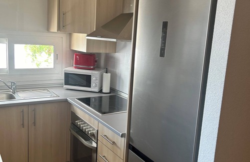 Roldan Apartment | Very well-equipped family apartment in a quiet golf course with swimming pool.