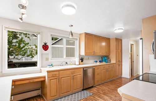 Agate House | Vibrant waterfront home with large deck, woodstove & striking sunset views