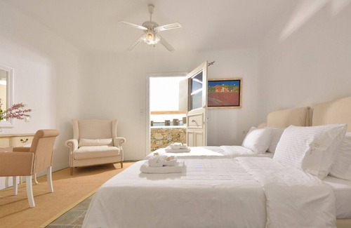 Ftelia Villa | Villa Juliet, beautiful beachfront villa in Mykonos with amazing sunset view by Elite Estates.