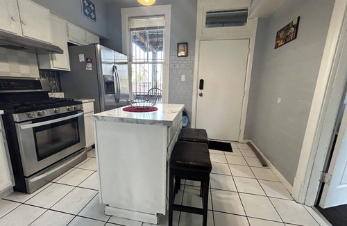 Logan Square House | Walkup Greystone steps to Logan Square restaurants, shopping bars and nightlife.