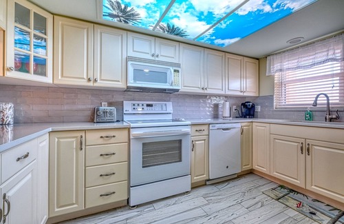 Indian Shores Condo | Watch the Boats Go By and Dolphins Play!