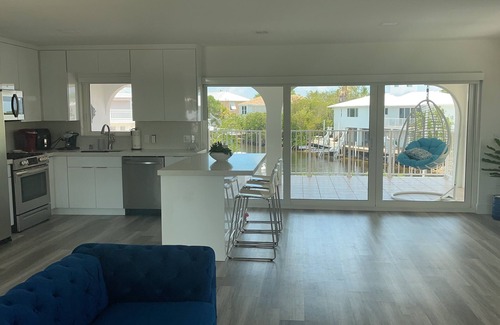 Long Key House | Water front property with bar, tennis, market place, and restaurants close by.