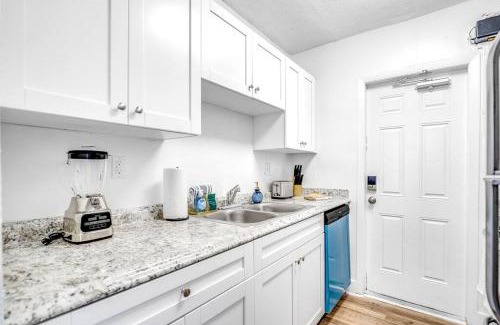 Survey Creek Apartment | Water View - 1st Floor - Stocked - Palm Wave Says