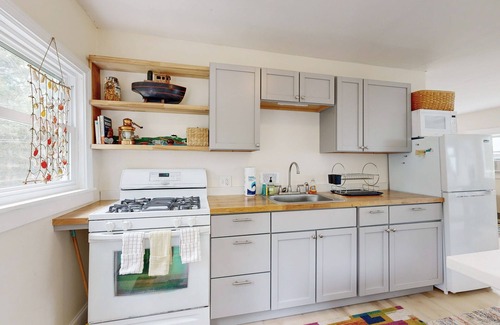Sebasco House | Water view home with scenic balcony, grill, board games, and AC