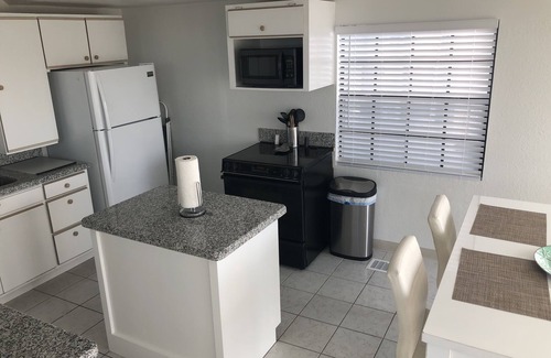 Port Isabel Cottage | Waterfront 1BR 2 bed in Long Island Village; Watch for Dolphin from the deck!