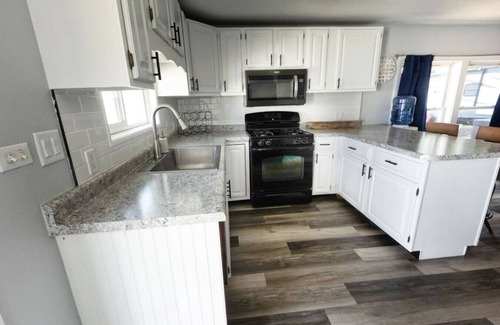 Spring Grove Cottage | Waterfront 2BR Nautical Cottage on Grass Lake - Hot Tub, Firepit & Year-Round Fun