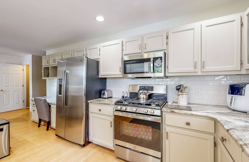Salisbury House | Waterfront allergy-free home with 40-foot fishing dock, canoe, home theater