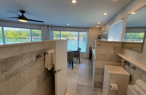 Nokomis House | Waterfront Boathouse One Room Bungalow with Private Beach Access