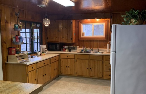 Old Forge House | Waterfront Camp with Boathouse - Wifi, kayaks, canoe and sandy bottom out front.