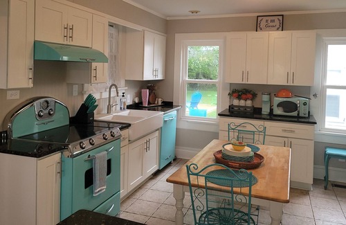 Colonial Beach House | Waterfront Coastal Farmhouse, Private Pier, Fire Pit with Separate Bunk House