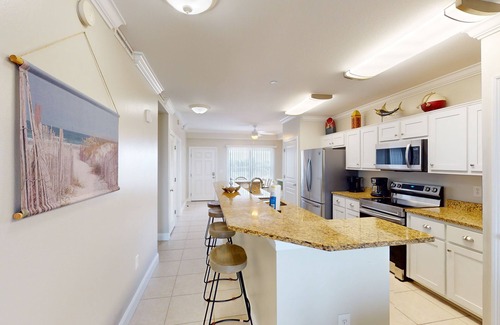 Mexico Beach Condo | Waterfront condo with pool, hot tub, furnished lanai, fireplace & chic furniture