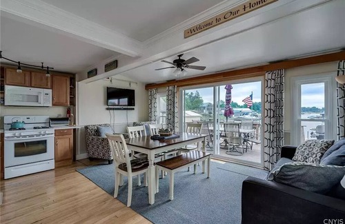 Alexandria Bay House | Waterfront Home with dock and a sunset view