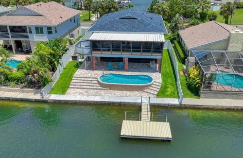 Spring Hill House | Waterfront home with pool and gameroom!