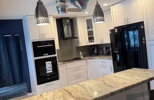 Palm Harbor House | Waterfront Lake Tarpon Home with heated salt water pool, fitness room, WiFi