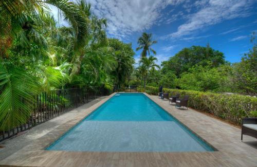 Captiva House | Waterfront Pink House with Private Dock & Pool