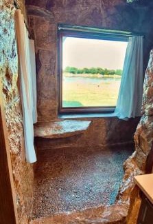 St. Joseph House | Waterfront Rock Shower Suite with Sunset View Room