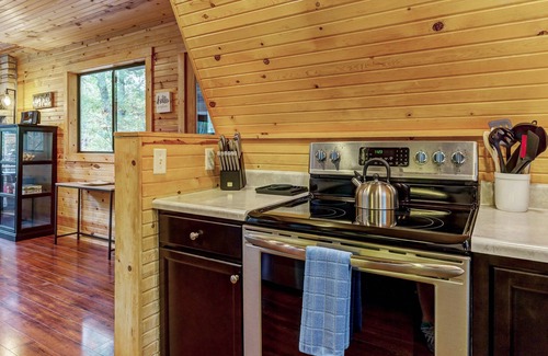 Wright City Ski Chalet | Waterside Cottage by Sarah Bernard with Firepit, Private Dock, and Hot Tub