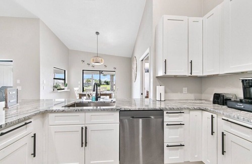Pebble Beach House | Waterside Villa! Family Home! Pool! BBQ! Fishing