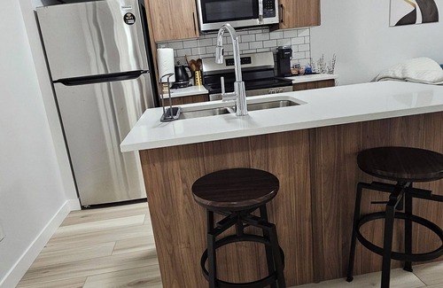 Regina House | Welcome to Heartland Suite-Your Modern Retreat in "The Greens"!