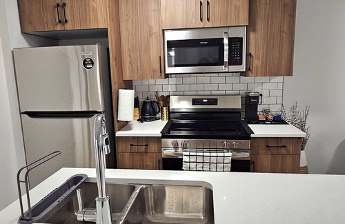 Regina House | Welcome to Heartland Suite-Your Modern Retreat in "The Greens"!