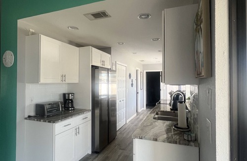 Englewood South House | Welcome to the haven 5 miles from the beach with hot tub.