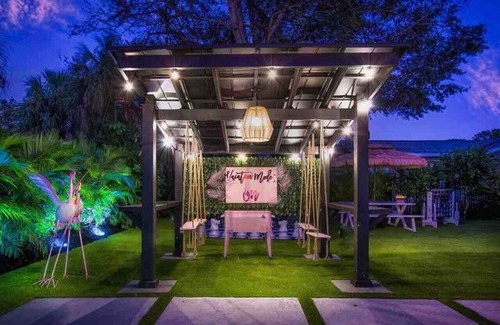 Bradenton House | Whimsical decor-pergola swings-moonlit hot tub-FUN