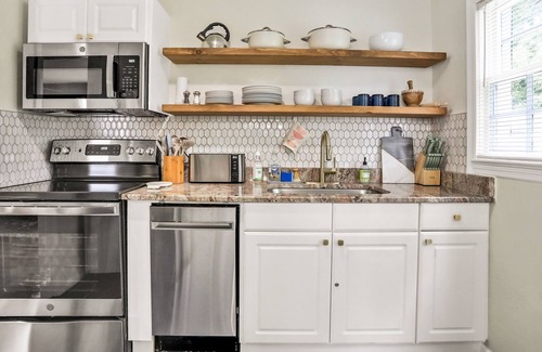 Oakford Park House | Whimsical Midtown home with covered porch, tennis & W/D - dog-friendly