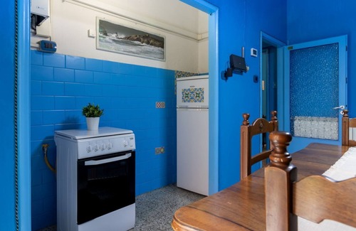 Ferrara Apartment | White Cross Square A Touch of Blue Apartment