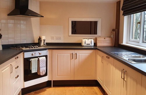 Brayford Cabin | Woodpecker Lodge, a secluded log cabin in beautiful north Devon