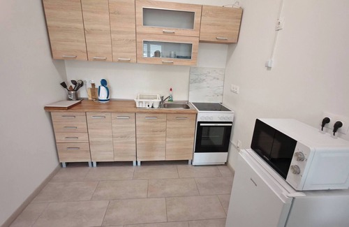 Kecskemet Apartment | WorkStay Apartment – Modern Comfort with Private Parking, Near City Amenities