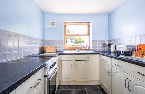 Llanfaelog House | Y Stabl: Pet-friendly cottage with stunning views