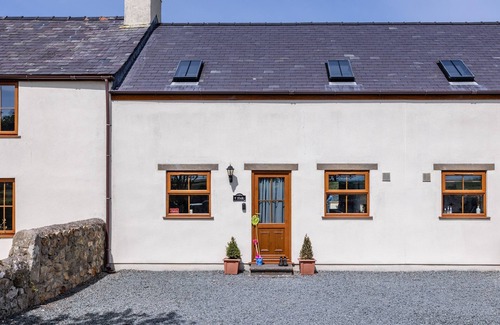 Llanfaelog House | Y Stabl: Pet-friendly cottage with stunning views