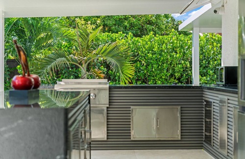 Ludlam Resort | You'll be captivated by the stunning 28 x 40 custom heated pool with jacuzzi