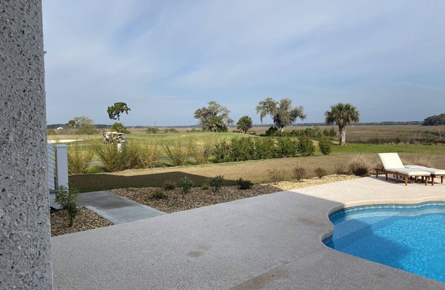 2 BEDROOM SUITE (SEPARATE FROM MAIN HOUSE) POOL, MARSH, GOLF AND WATER VIEWS