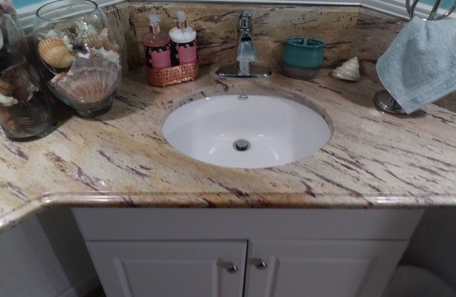 2 bedroom suite with a full kitchen, living room, and a full bathroom.