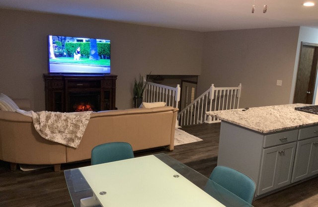 2000 sq ft home with a swimming pool and a hot tub