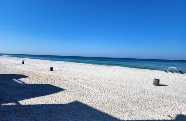 2022 Renovation! Surf side and stones throw from the beach!