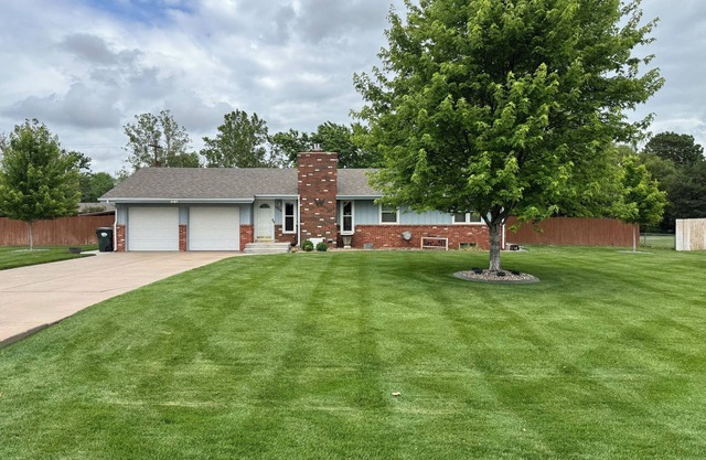 4-bedroom home in Hutchinson with beautiful yard and patio. Pet friendly! Enjoy!