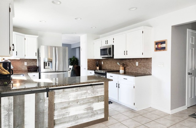 4 Bedroom Home with 2 living rooms, patio, & backyard.