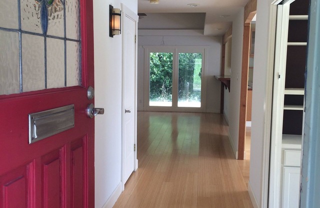 5 minutes to downtown! Family home with fenced yard, deck, wooded lot