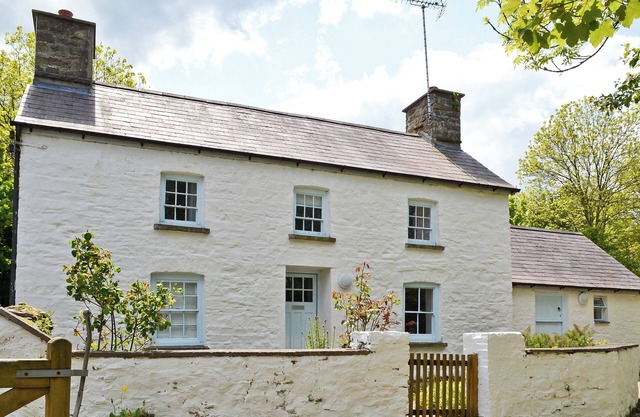 A detached character cottage with beams, wood burner and enclosed garden.