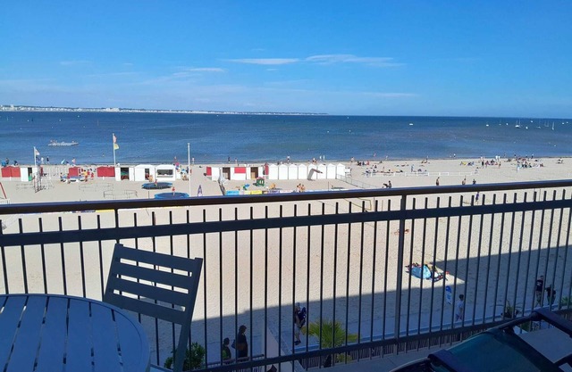 A panoramic view of Nau beach and the sea, refurbished and warm.